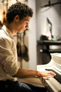dating photo of a man playing the piano
