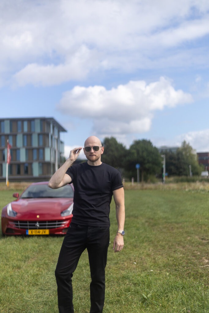 Dating photo of a man with a sports car in the background