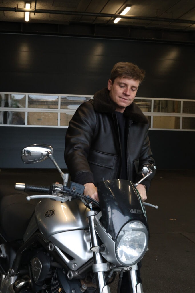 Dating photo of a man working on his motorcycle